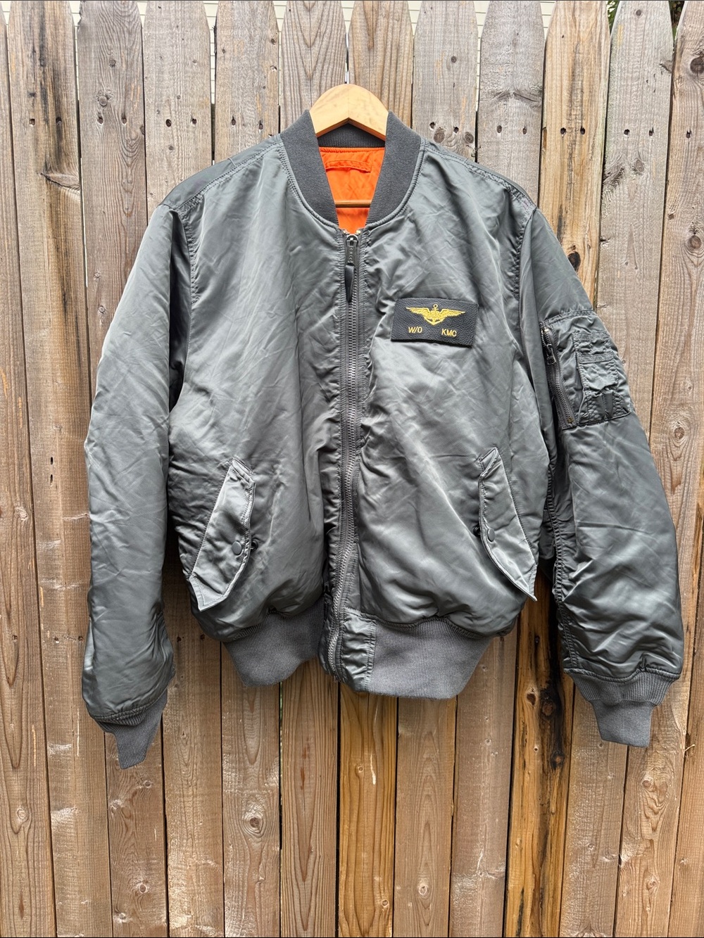 Military-Style Bomber Jacket in Olive Green with Orange Lining